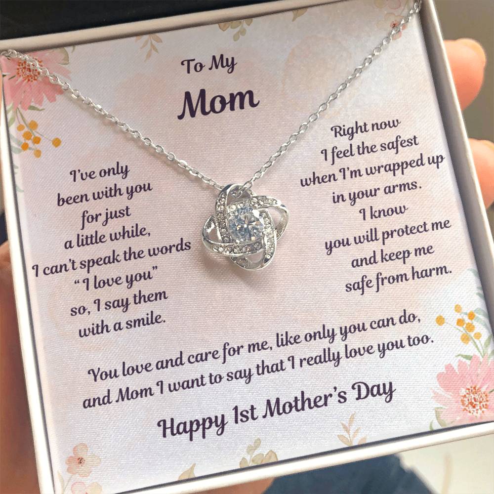 White Gold Love Knot Necklace Center CZ crystal, surrounded by smaller crystals- To My Mom- I've only been with you for just a little while, I can't speak the words "I love you" so, I say them with a smile. Right now I feel the safest when I'm wrapped up in your arms. I know you will protect me and keep me safe from harm. You love and care for me, like only you can do, and Mom I want to say that I really love you too. - Givethegifts.com