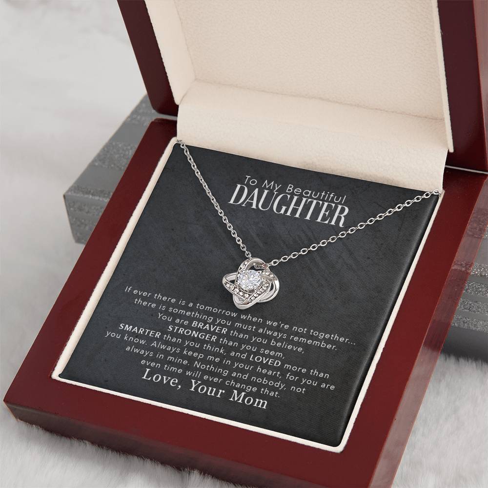 White Gold Love Knot Necklace with large CZ at center, surrounded by smaller crystals. Luxury Gift Box. Message reads: To My Beautiful Daughter: If ever there is a tomorrow when we are not together... There is something you must always remember. You are BRAVER than you believe, STRONGER than you seem, SMARTER than you think, and LOVED more than you know. Always keep me in your heart, for you are always in mine. Nothing and nobody, not even time will ever change that. Love, Your Mom