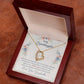 Yellow Gold Forever Love Heart Necklace with large CZ crystal in center, and smaller crystals along one side. Shown in Luxury Gift Box. Message reads:To My Granddaughter: When life tries to knock you down, this old woman will always have your back. I hope you believe in yourself as much as I believe in you. I love you for all that you are, all that you have been, and all that you are yet to be. Love, Your Grandmother.