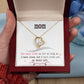 Gold heart necklace with cubic zirconia in the center and several smaller stones on one side. Shown in luxury gift box. Message reads: Mom You have loved me for as long as I have lived, but I have loved you my whole life.