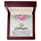 Yellow Gold Love Knot Necklace with large CZ crystal at center and surrounding smaller crystals. Shown in Luxury Gift Box. Message reads: To My Granddaughter: If ever there is tomorrow when we're not together... there is something you must always remember. You are BRAVER than you believe, STRONGER than you seem, SMARTER than you think, and LOVED more than you know. Always keep me in your heart, for you are always in mine. Nothing and nobody, not even time, will change that.