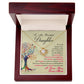 Yellow Gold Love Knot Necklace with a large CZ crystal at the center surrounded by smaller crystals. Shown in a Luxury Gift Box. Message card reads :To My Beautiful Daughter: If I could only give you one thing in this life, I would give you the ability to see yourself how I see you every single day. Your beauty, your kindness, how happy you make me and how proud I am of you. Perhaps then you would be able to understand just how special you are to me. I love you, Love, Mom. With a colorful image of a tree.