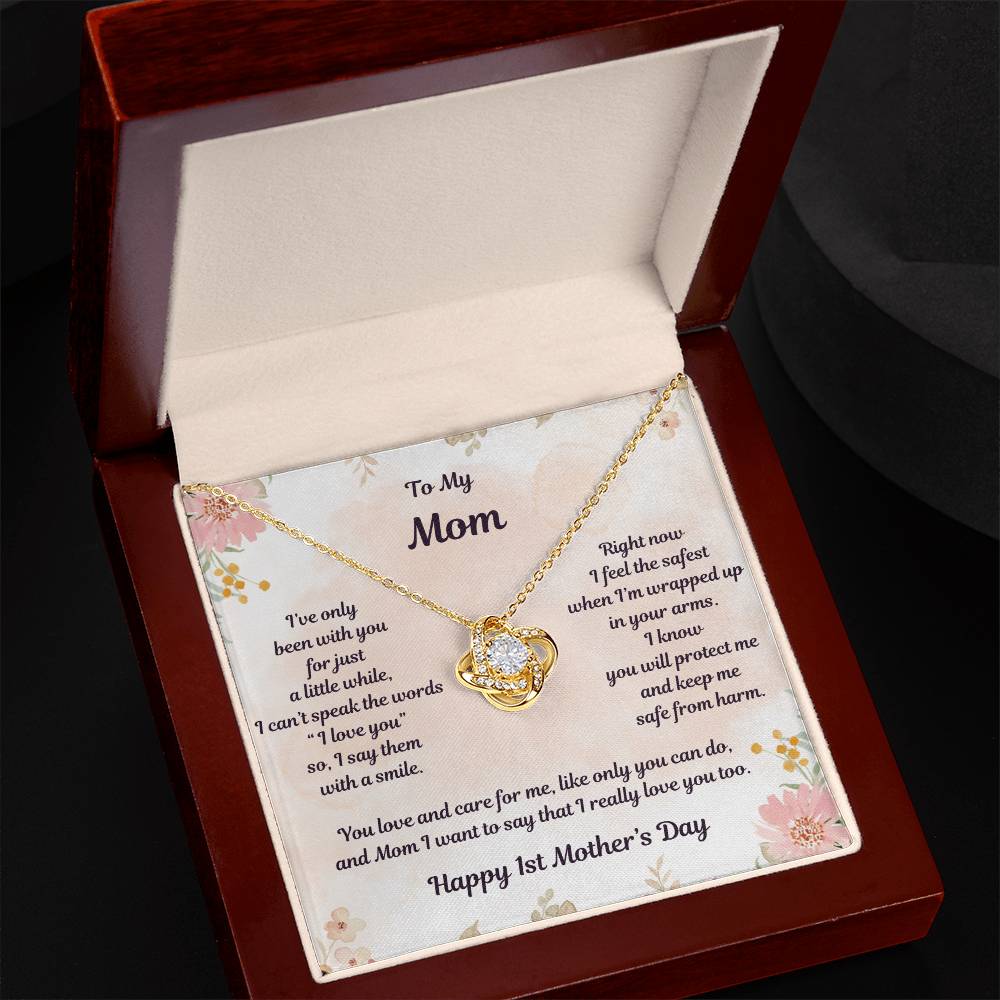 Yellow Gold Love Knot Necklace Center CZ crystal, surrounded by smaller crystals- To My Mom- I've only been with you for just a little while, I can't speak the words "I love you" so, I say them with a smile. Right now I feel the safest when I'm wrapped up in your arms. I know you will protect me and keep me safe from harm. You love and care for me, like only you can do, and Mom I want to say that I really love you too. - Givethegifts.com