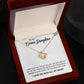 Yellow Gold Love Knot Necklace with Large CZ crystal in center, urrounded by smaller crystals. Shown in Luxury Gift Box. Message card reads: To My Bonus Daughter: I didn't give you the gift of life, life gave me the gift of you. Thanks fo rbeing such a wonderful person, always shine like the brightest star. I love you with all my heart.
