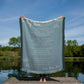 Blue Woven Blanket. Message reads: To My Mom, I've only been with you for just a little while, I can;t speak the words "I LOVE YOU" so I say them with a smile. Right now I feel the safest when I'm wrapped up in your arms. I know you will protect me , and keep me safe from harm. When you rock me in your arms to go to sleep at night, I drift soundly off to sleep as I know everything's alright. You love and care for me, like only you can do, and MOM I want to say that I really love you too. Love, Your Son